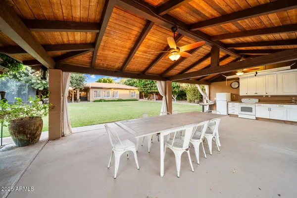 a view of a dining room with furniture and a livingroom