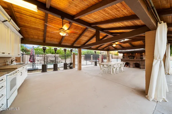an aerial view of a house with a swimming pool