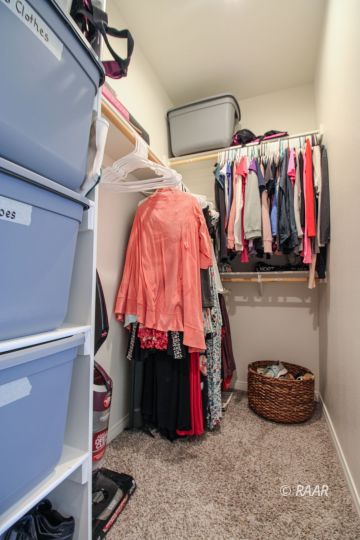 428 Scott Street Ridgecrest, CA 93555 - Photo 21 of 35 a view of walk in closet with clothes and shoes