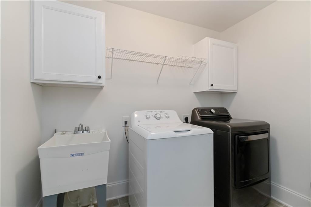 3320 Spencer Street Cumming, GA 30041 - Photo 32 of 90 a utility room with dryer and washer