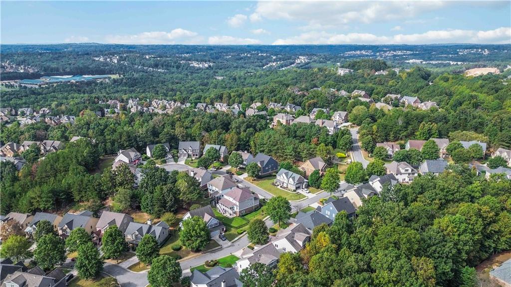 3320 Spencer Street Cumming, GA 30041 - Photo 76 of 90 an aerial view of a city with lots of residential buildings