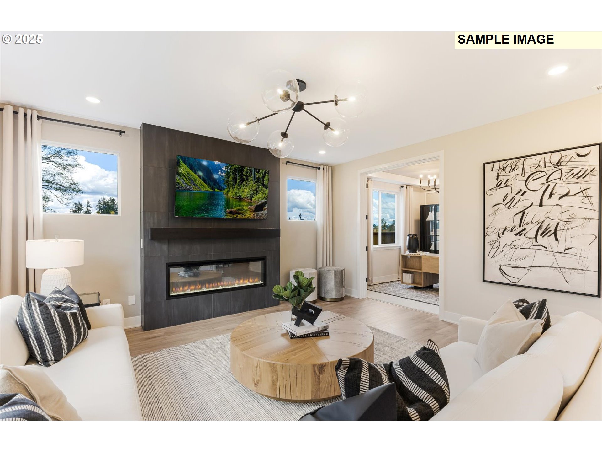 360 South 88th Avenue Ridgefield, WA 98642 - Photo 6 of 23 a living room with furniture a flat screen tv and a fireplace