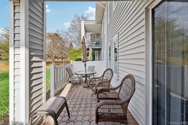 a view of a balcony with chairs