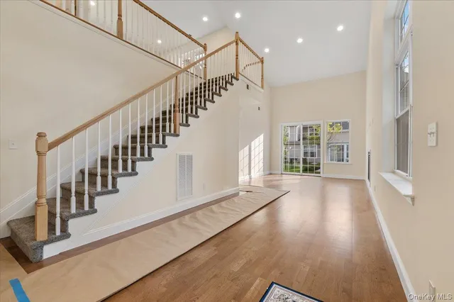 a view of an entryway with wooden floor