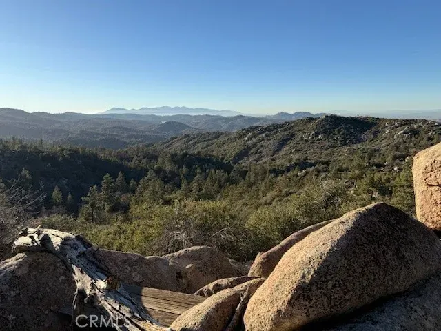 a view of a house with a mountain yard