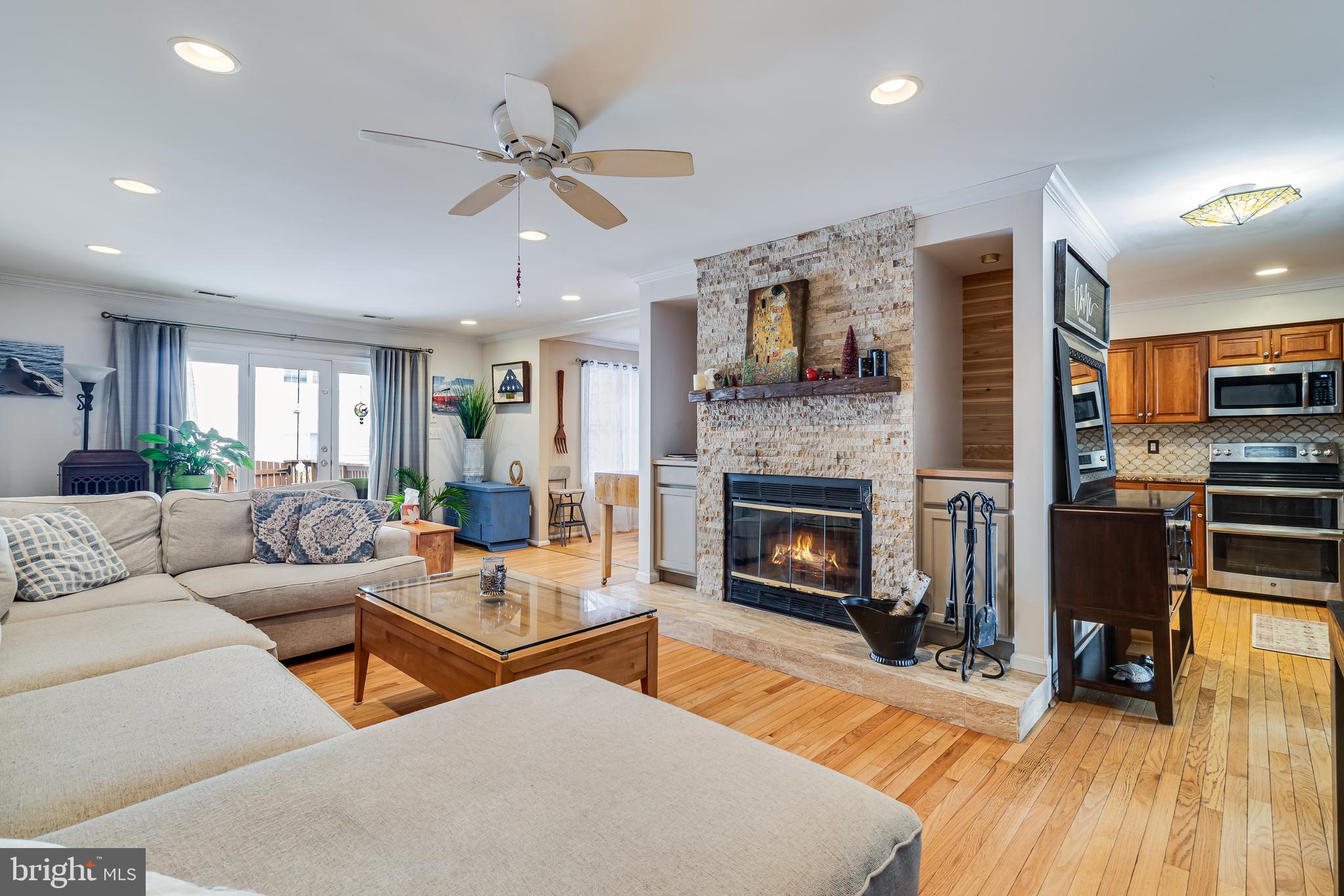 734 Belle Field, Unit 98 Dowell, MD 20629 - Photo 8 of 24 Living Room with wood burning fire place