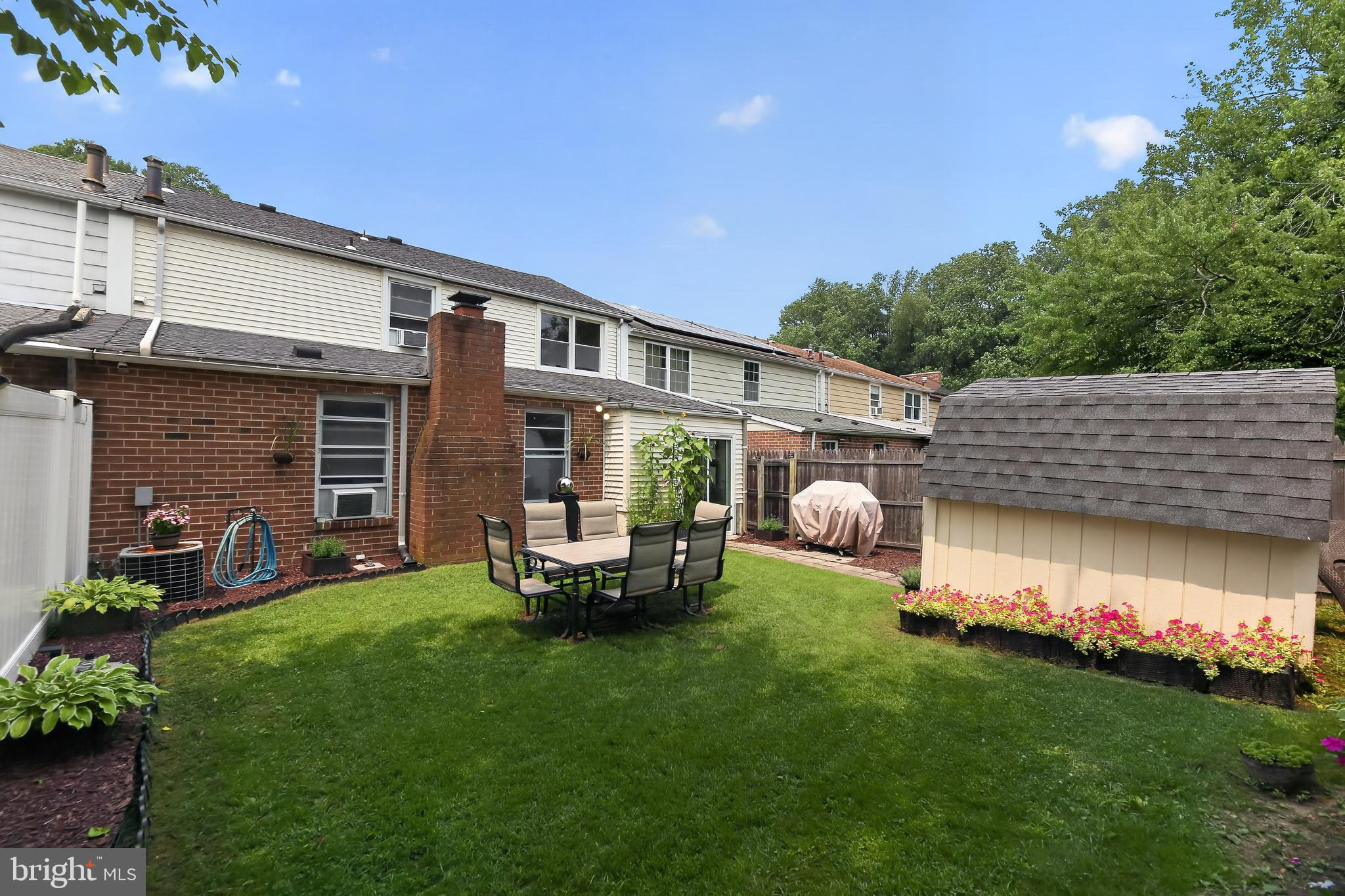 1802 Winding Way Clementon, NJ 08021 - Photo 28 of 30 a view of a house with backyard sitting area and garden