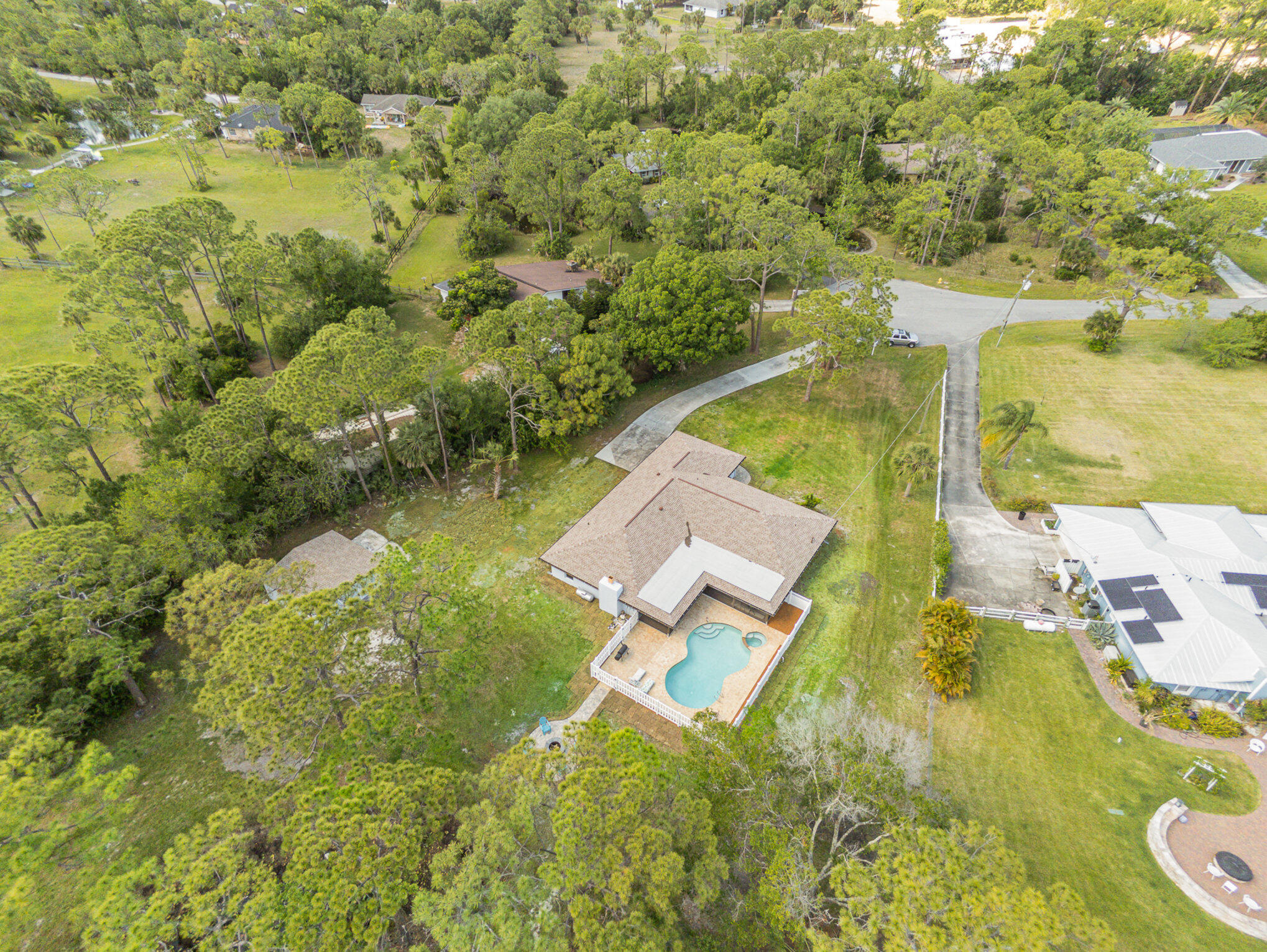 4561 Mustang Road Melbourne, FL 32934 - Photo 1 of 25 an aerial view of residential houses with outdoor space