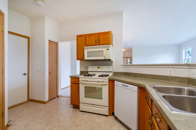 a kitchen with stainless steel appliances granite countertop a stove and a sink