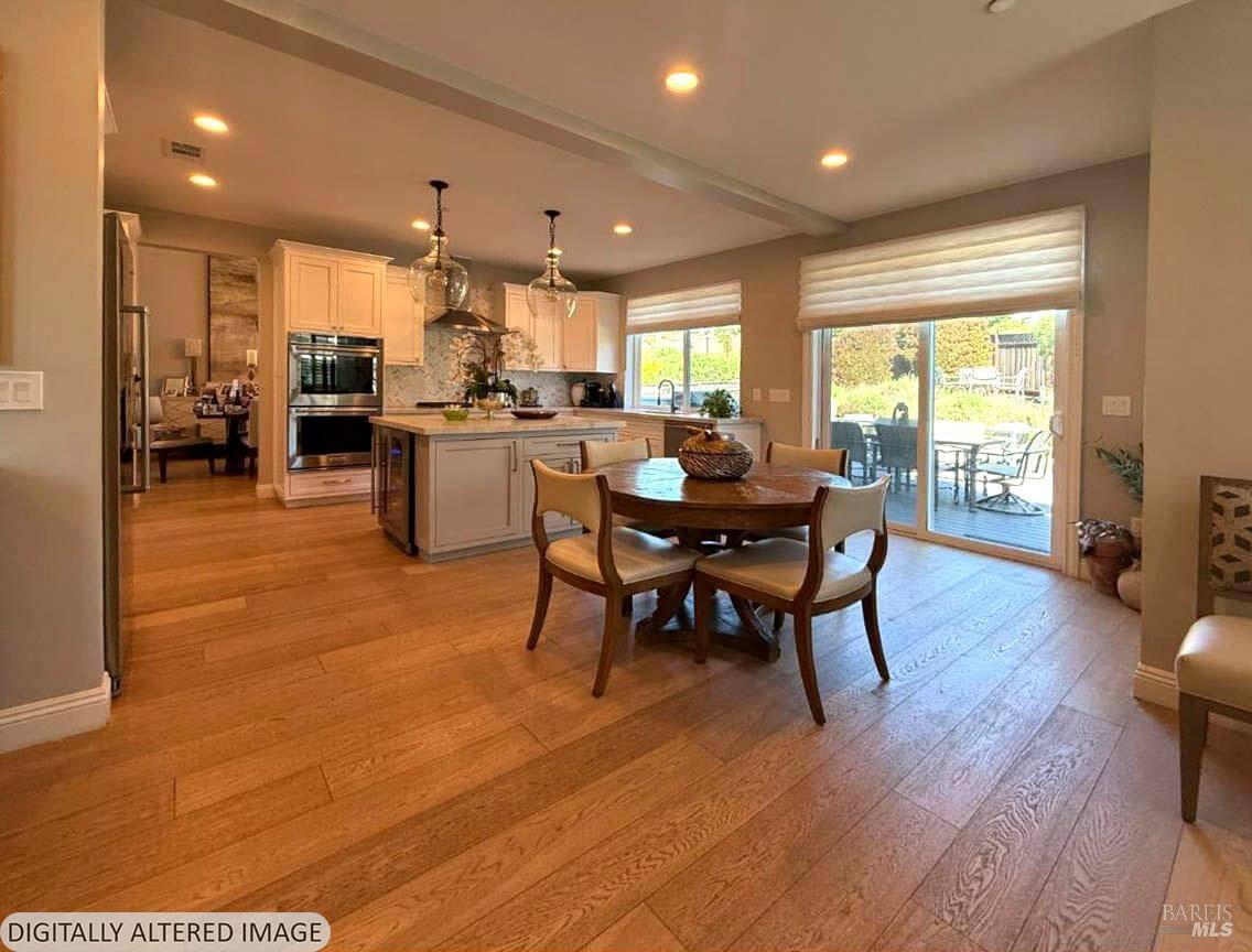 3726 Cannes Place Santa Rosa, CA 95403 - Photo 23 of 69 Here is a view form the family room towards the kitchen and sliding glass door that leads out to the attached deck and backyard. Let's go outside!