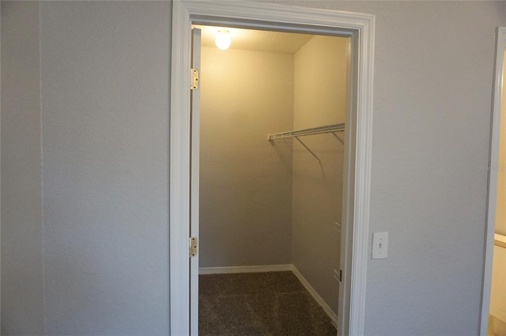 852 Grand Regency Pointe, Unit 205 Altamonte Springs, FL 32714 - Photo 9 of 11 a bathroom with a glass shower door