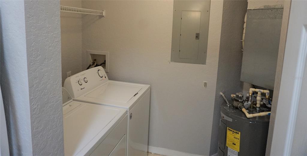 852 Grand Regency Pointe, Unit 205 Altamonte Springs, FL 32714 - Photo 10 of 11 a utility room with dryer and washer