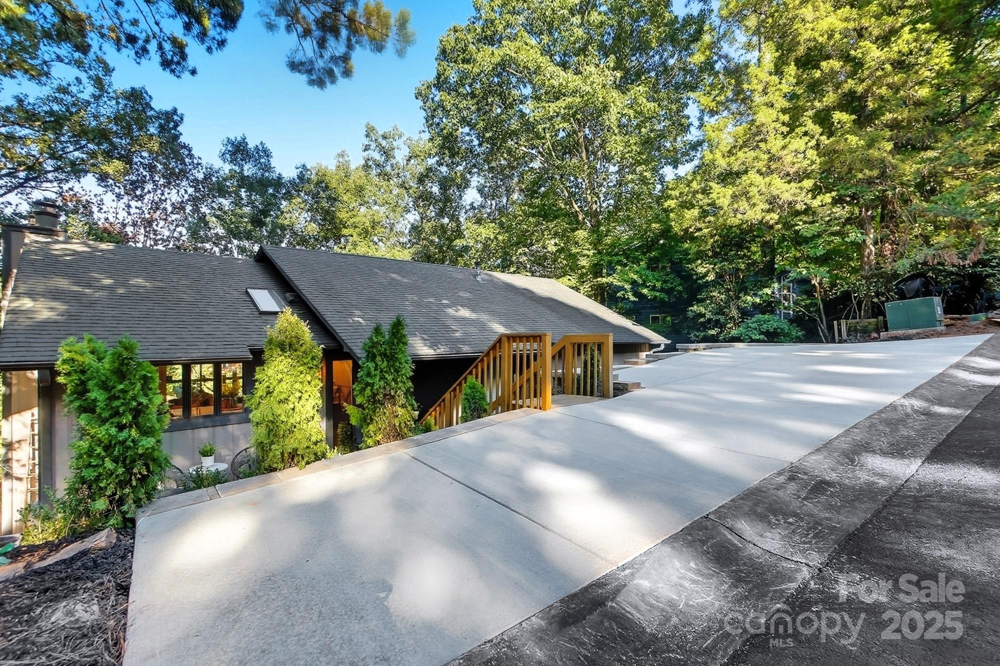 10043 Tepa Place Tega Cay, SC 29708 - Photo 3 of 43 a view of a house with a street