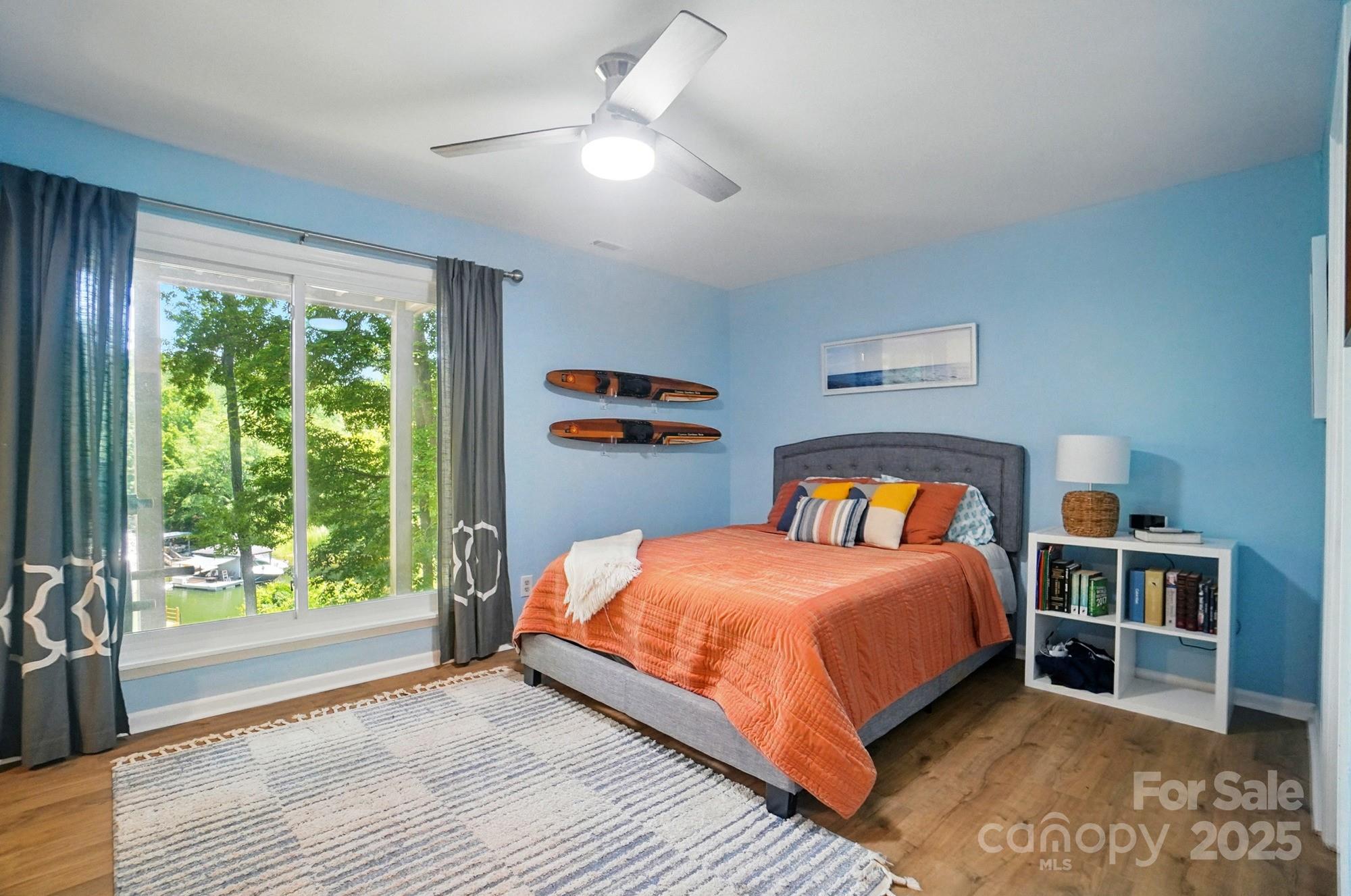 10043 Tepa Place Tega Cay, SC 29708 - Photo 33 of 43 a bedroom with a bed and a large window