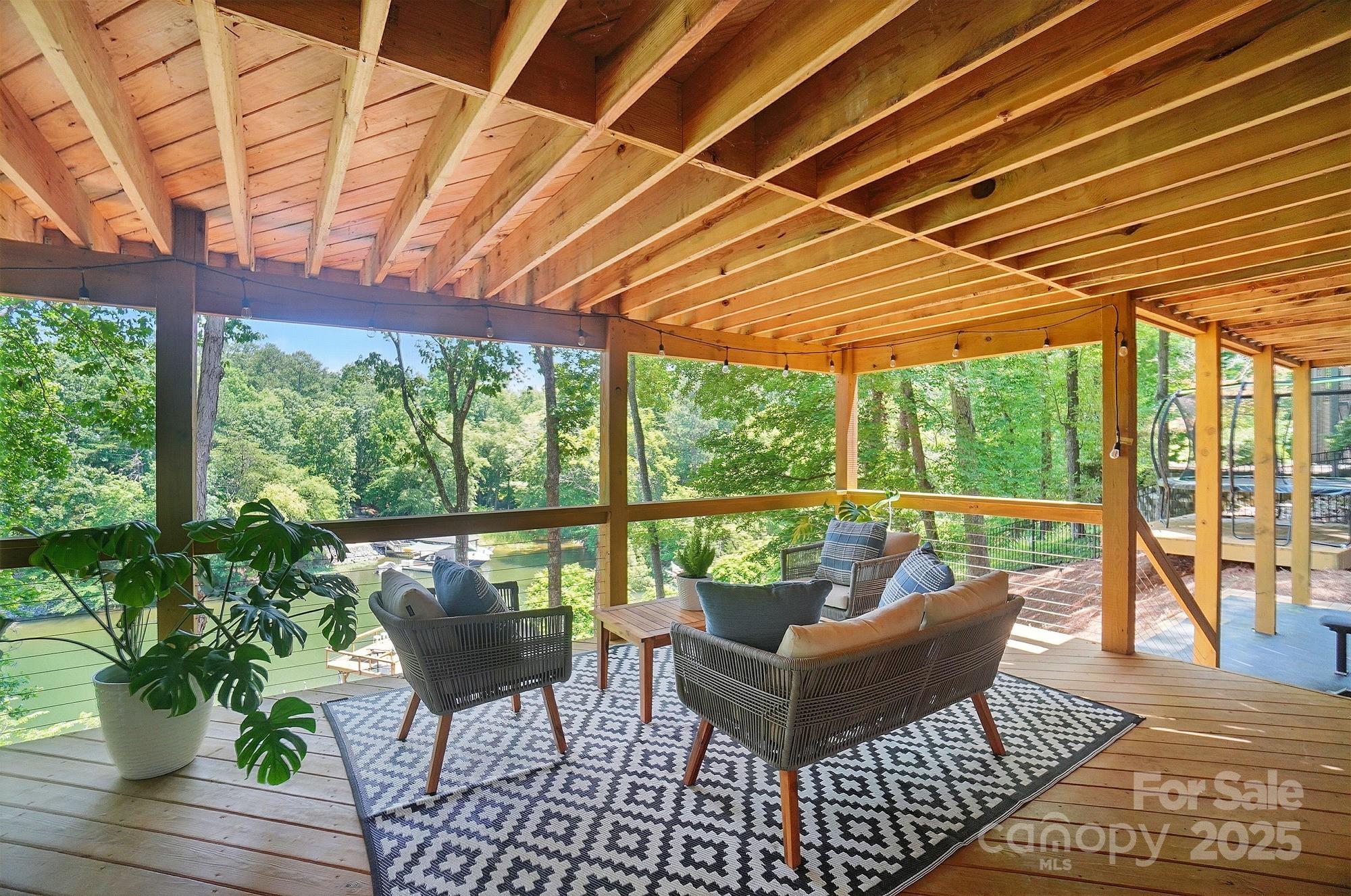 10043 Tepa Place Tega Cay, SC 29708 - Photo 35 of 43 a balcony with furniture and wooden floor
