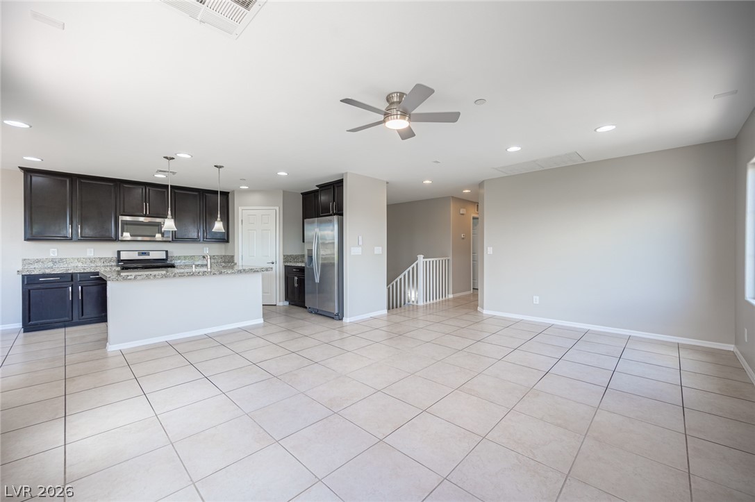 9916 Sable Point Street Las Vegas, NV 89178 - Photo 29 of 73 An open-concept living area boasts a modern kitchen with a large island and ample space.