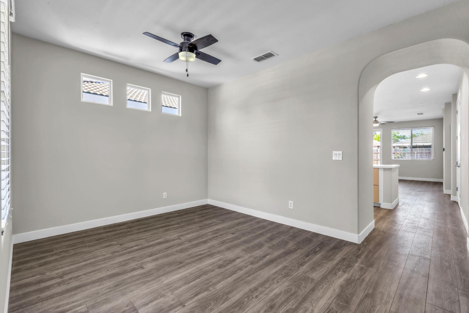 1839 Dawnelle Way Sacramento, CA 95835 - Photo 13 of 56 wooden floor in an empty room with a window