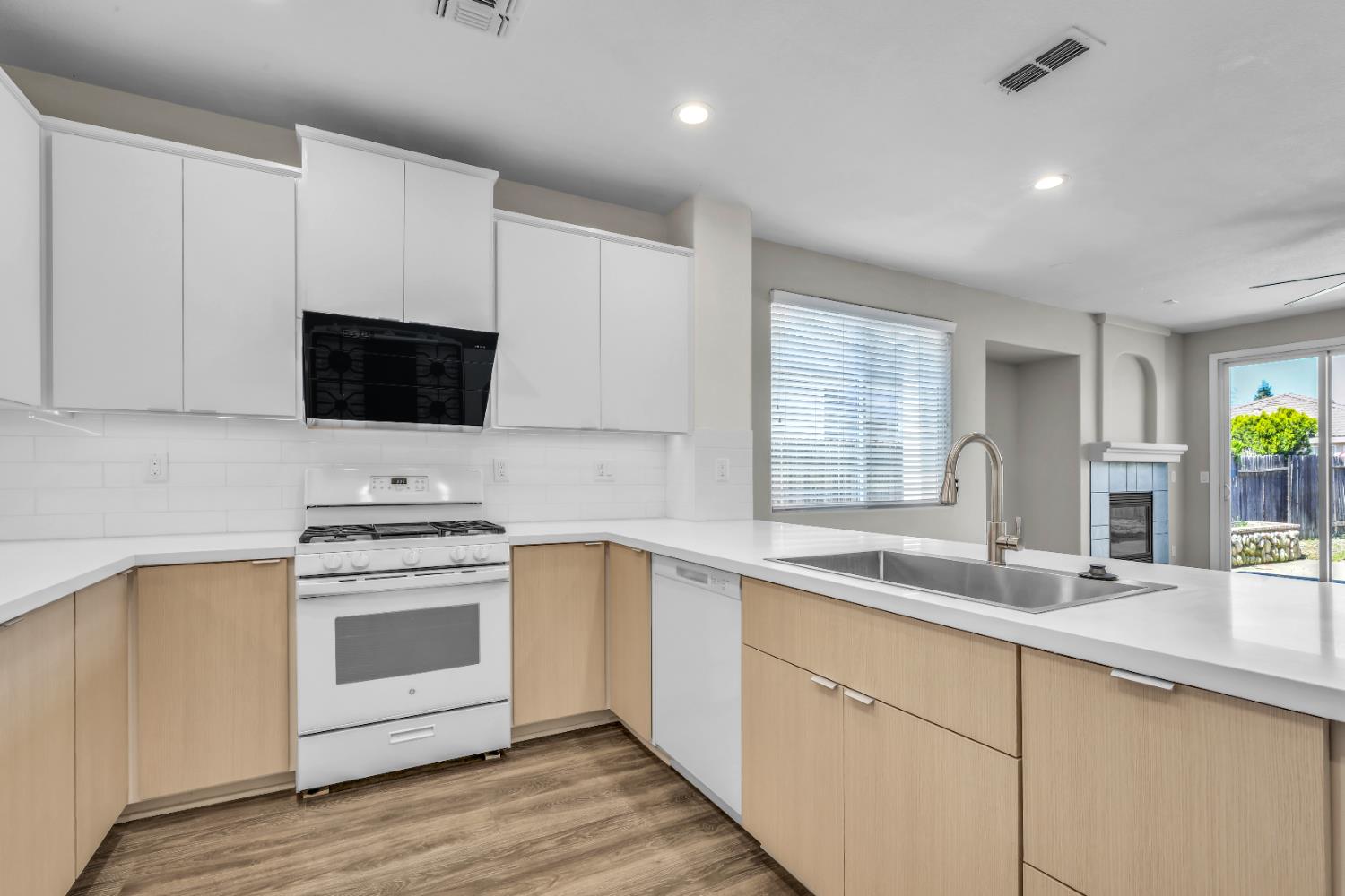 1839 Dawnelle Way Sacramento, CA 95835 - Photo 14 of 56 a kitchen with a sink stove and microwave