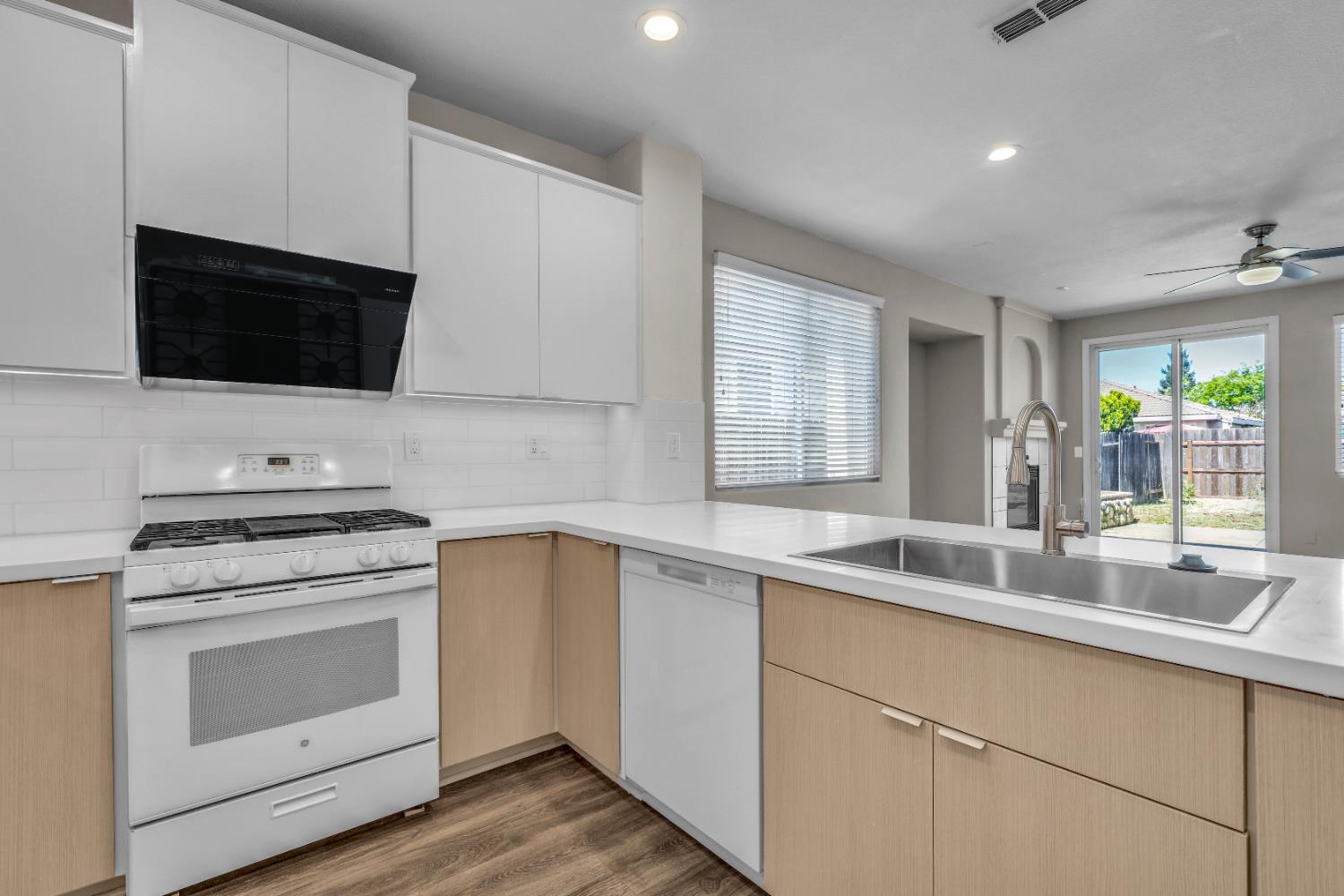 1839 Dawnelle Way Sacramento, CA 95835 - Photo 16 of 56 a kitchen with a sink stove and microwave