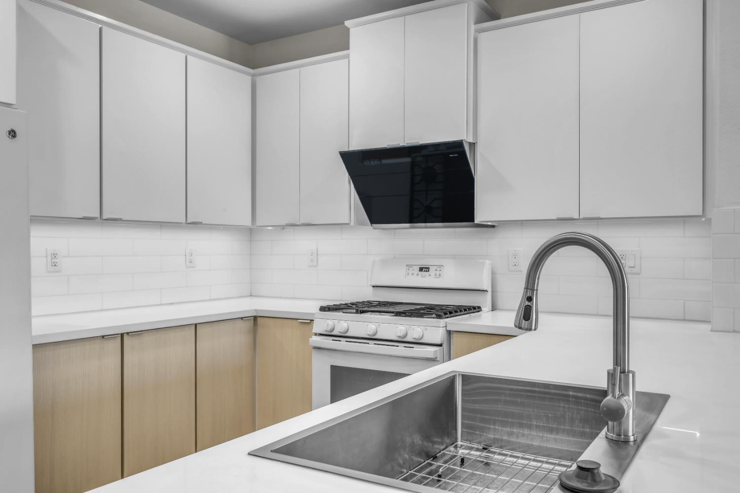 1839 Dawnelle Way Sacramento, CA 95835 - Photo 18 of 56 a kitchen with a cabinets and white appliances