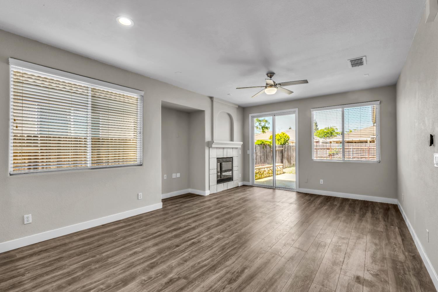 1839 Dawnelle Way Sacramento, CA 95835 - Photo 22 of 56 an empty room with wooden floor and windows