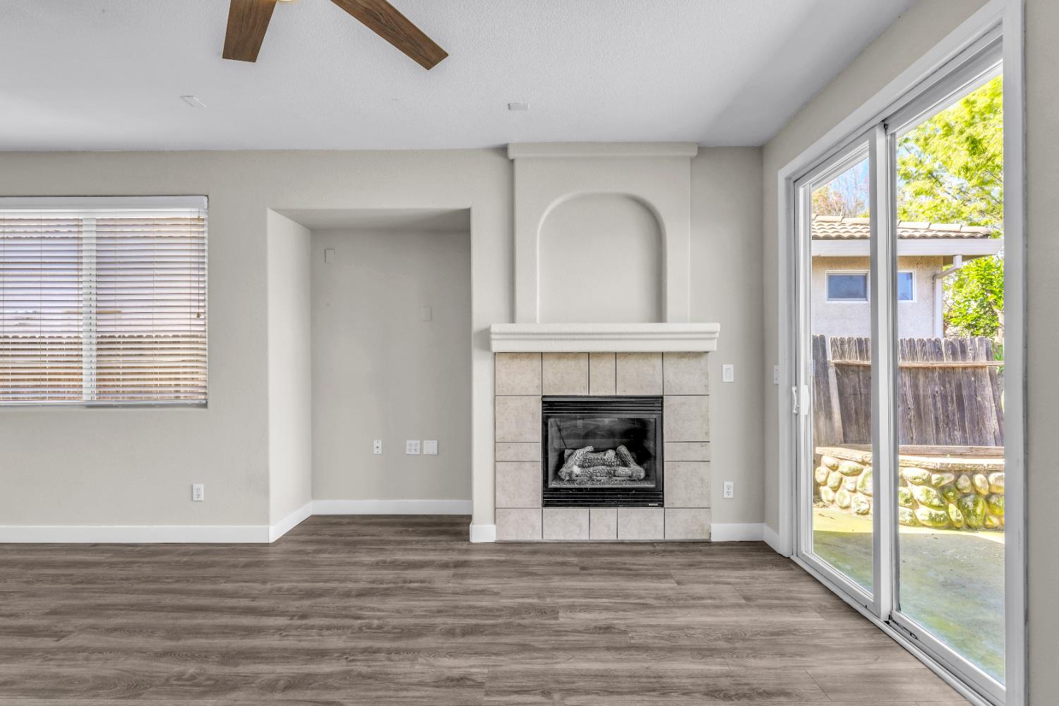1839 Dawnelle Way Sacramento, CA 95835 - Photo 24 of 56 a view of an empty room with wooden floor and a fireplace