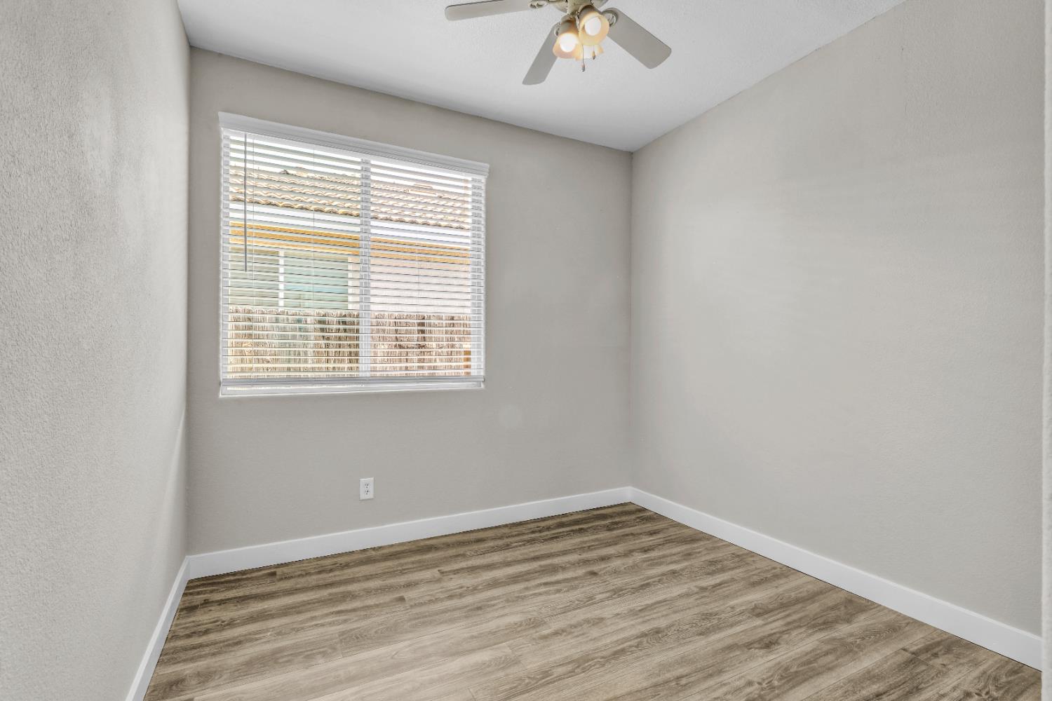 1839 Dawnelle Way Sacramento, CA 95835 - Photo 29 of 56 wooden floor in an empty room with a window