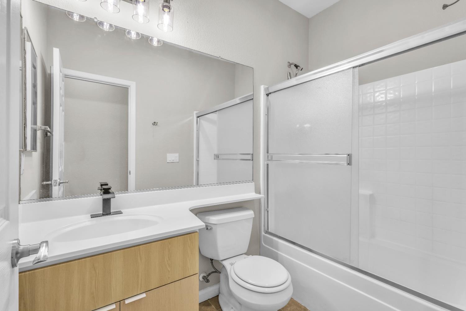 1839 Dawnelle Way Sacramento, CA 95835 - Photo 31 of 56 a bathroom with a sink a toilet and shower