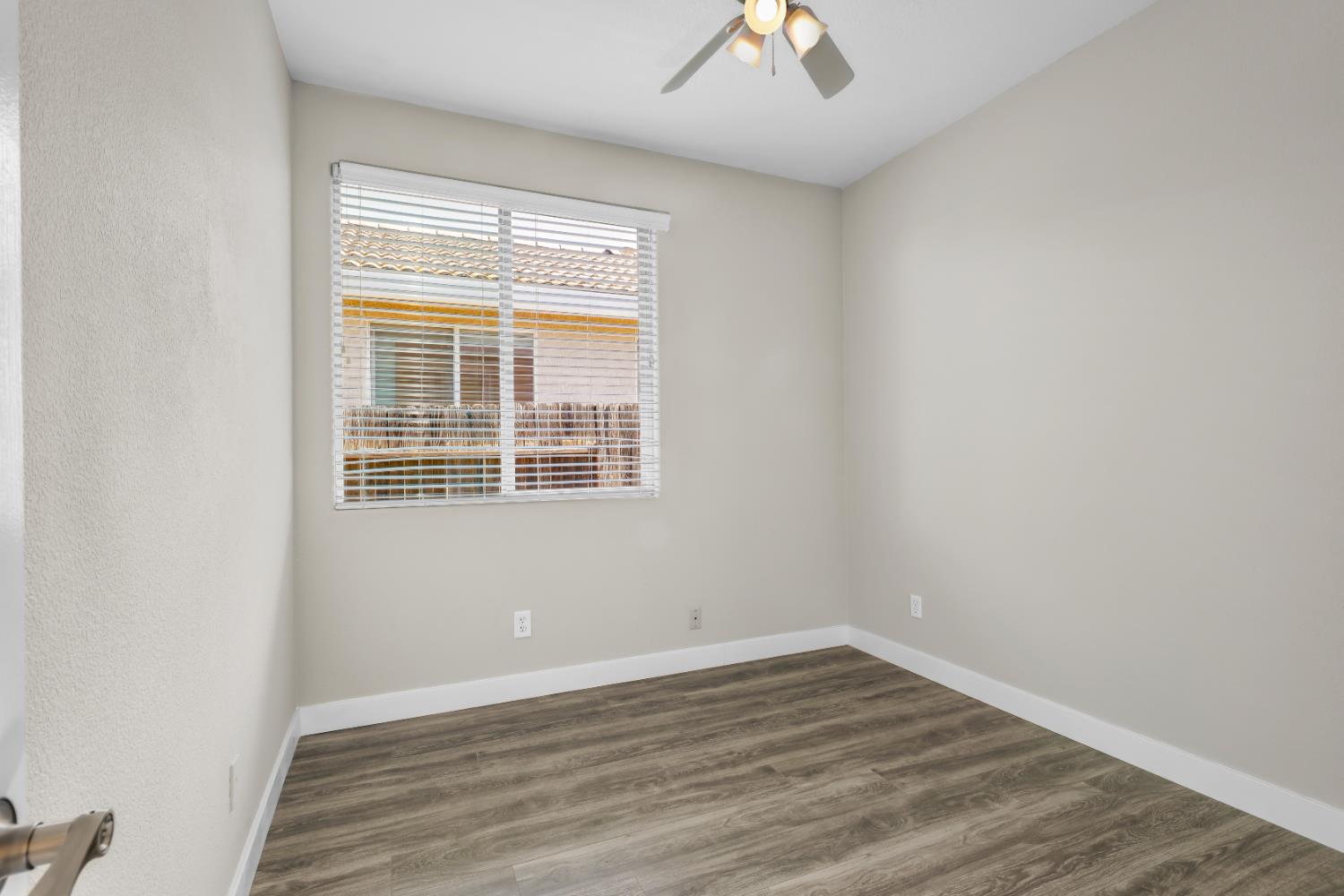 1839 Dawnelle Way Sacramento, CA 95835 - Photo 32 of 56 wooden floor in an empty room with a window