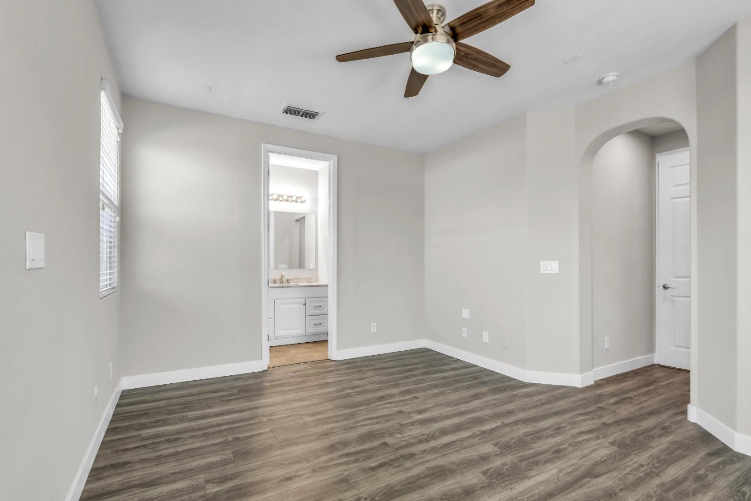 1839 Dawnelle Way Sacramento, CA 95835 - Photo 38 of 56 an empty room with wooden floor and windows