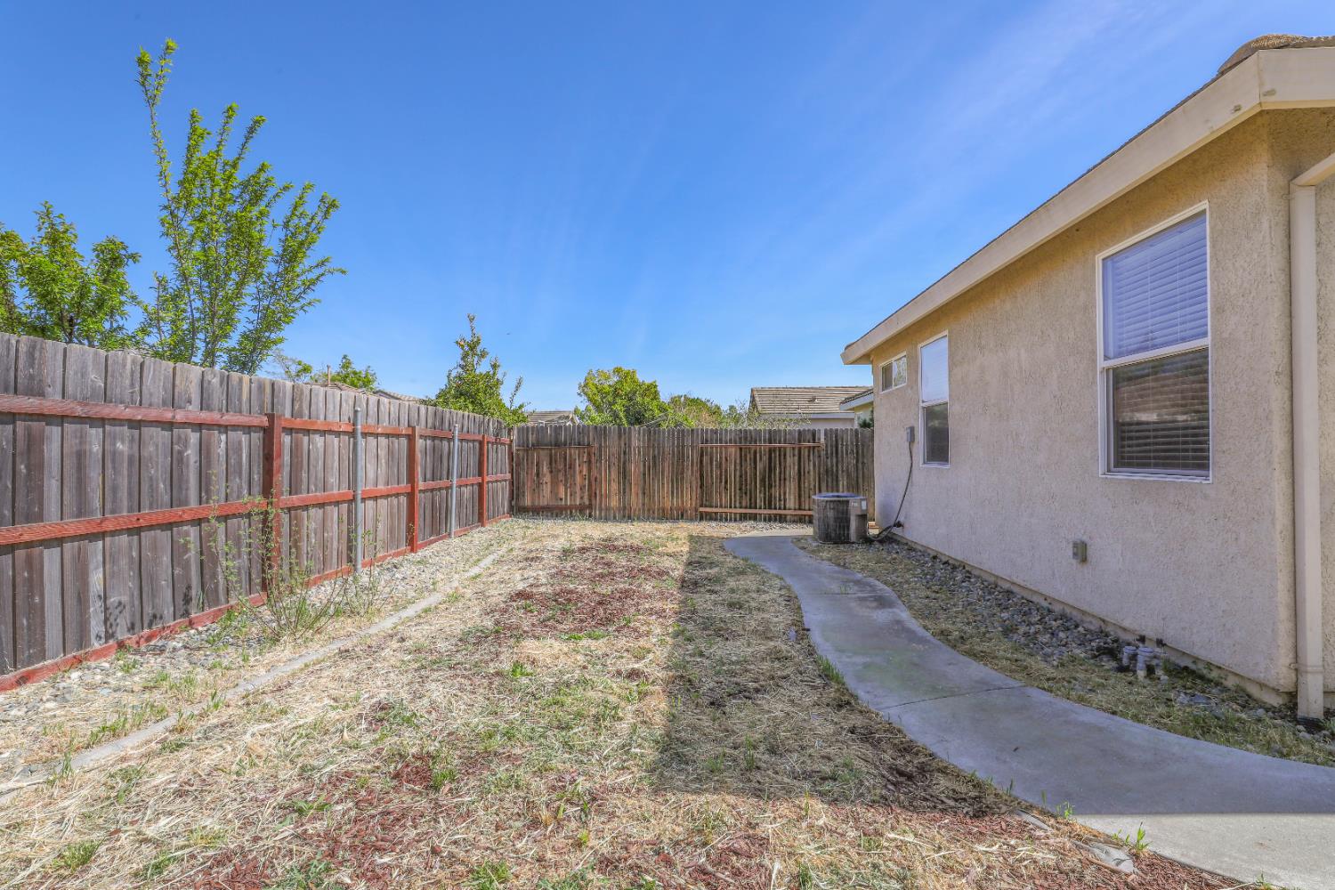 1839 Dawnelle Way Sacramento, CA 95835 - Photo 9 of 56 a view of a backyard with wooden fence