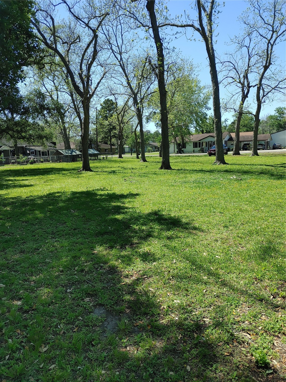 0 South Hackberry Street Sweeny, TX 77480 - Photo 2 of 6 a view of grassy field with benches and trees