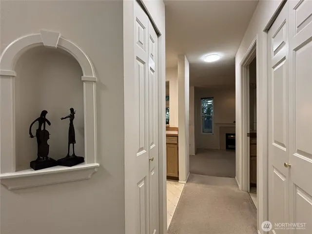 a view of a hallway with a living room