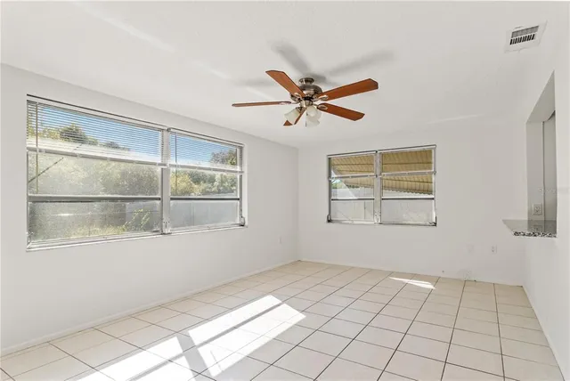 a view of an empty room with a window