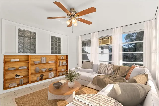 a living room with furniture and window