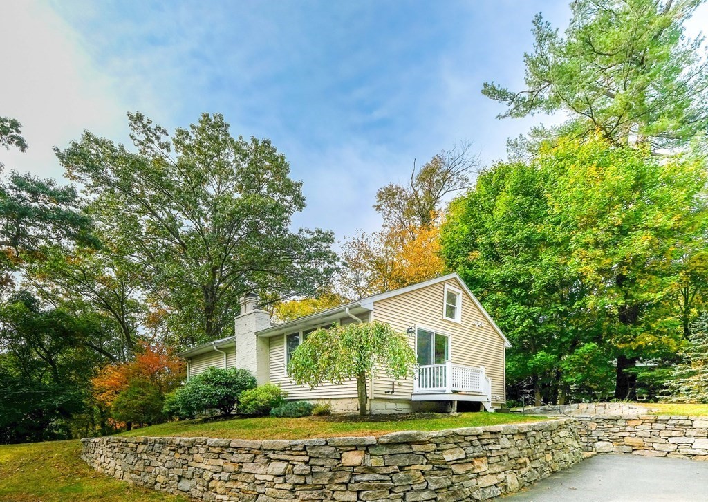 223 Stonebridge Road Wayland, MA 01778 - Photo 1 of 6 a view of a house with a yard