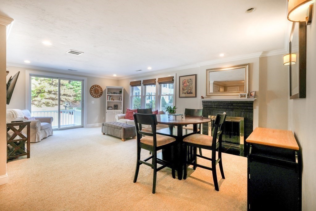 223 Stonebridge Road Wayland, MA 01778 - Photo 2 of 6 a dining room with furniture and a floor to ceiling window