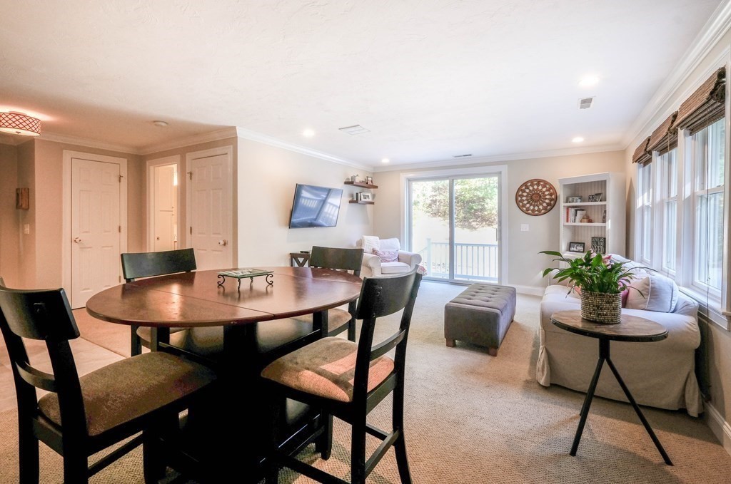223 Stonebridge Road Wayland, MA 01778 - Photo 3 of 6 a view of a dining room with furniture and wooden floor