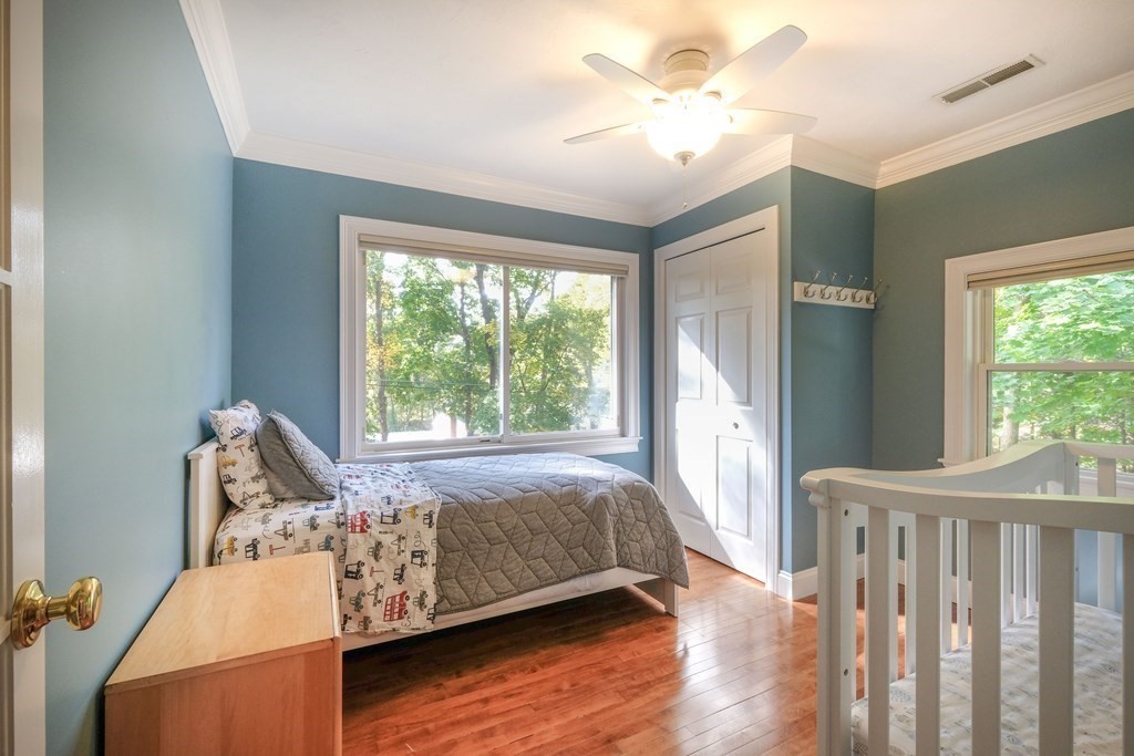223 Stonebridge Road Wayland, MA 01778 - Photo 4 of 6 a bed room with a bed and a window
