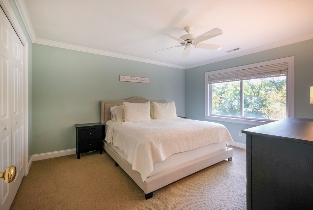 223 Stonebridge Road Wayland, MA 01778 - Photo 5 of 6 a bedroom with a bed and window