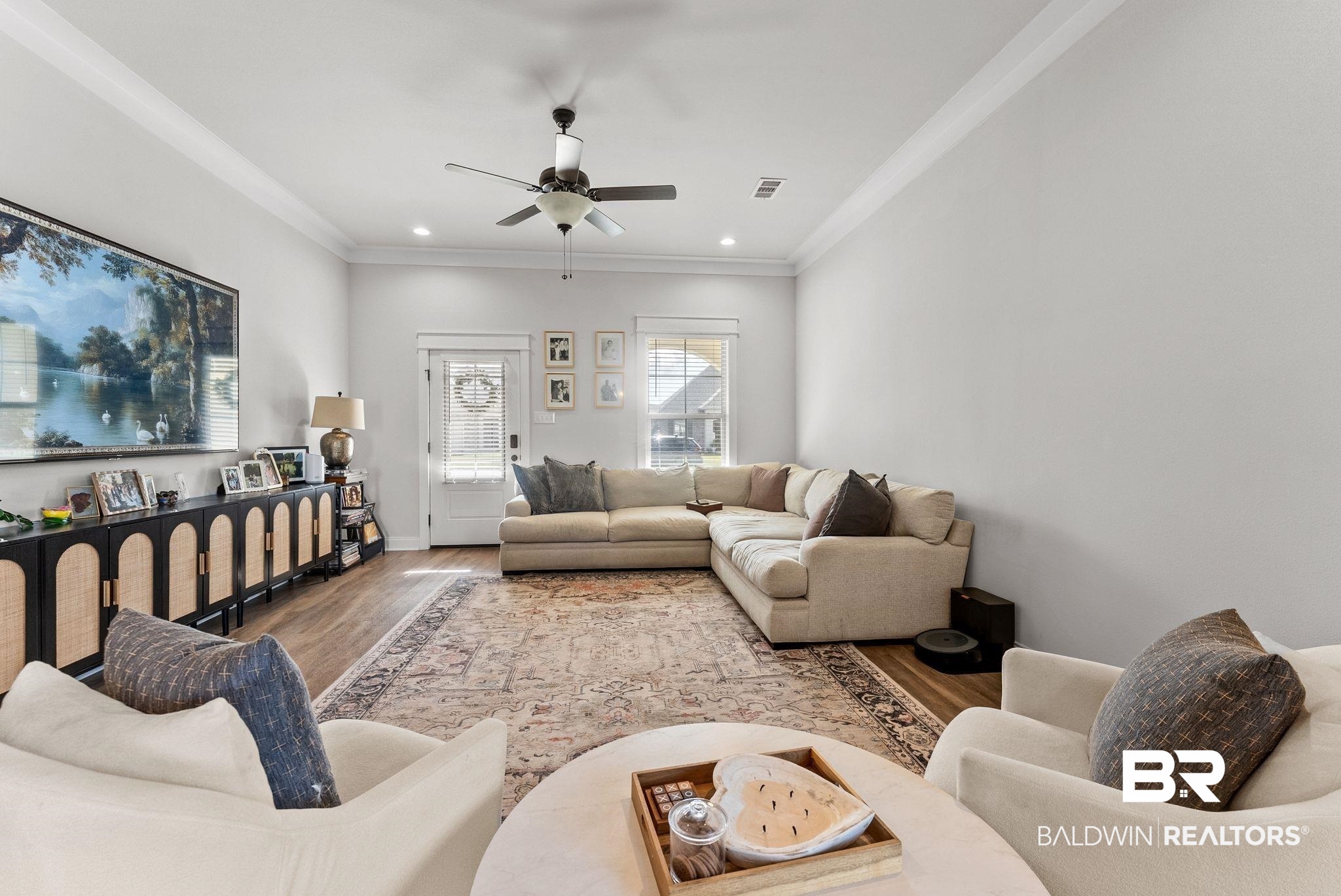 10745 Brodick Loop Daphne, AL 36527 - Photo 6 of 39 Living room with ceiling fan, ornamental molding, wood finished floors, and recessed lighting