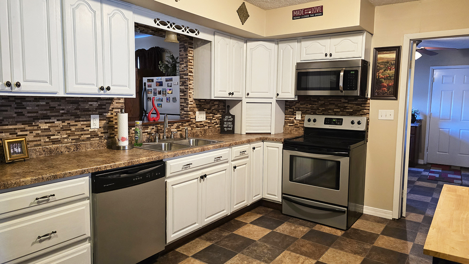 614 East Superior Street Irvington, IL 62848 - Photo 15 of 41 a kitchen with a sink stove and microwave