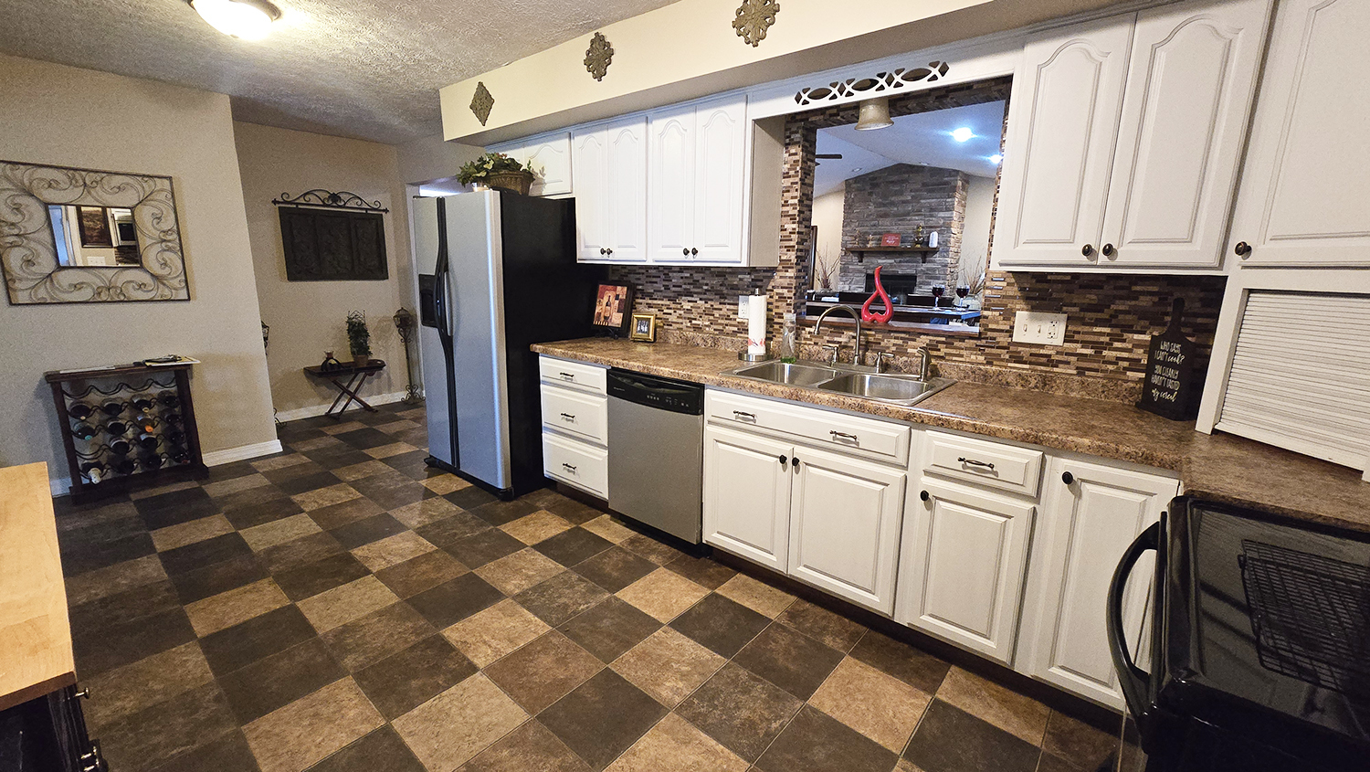 614 East Superior Street Irvington, IL 62848 - Photo 16 of 41 a kitchen with stainless steel appliances a sink cabinets and a window
