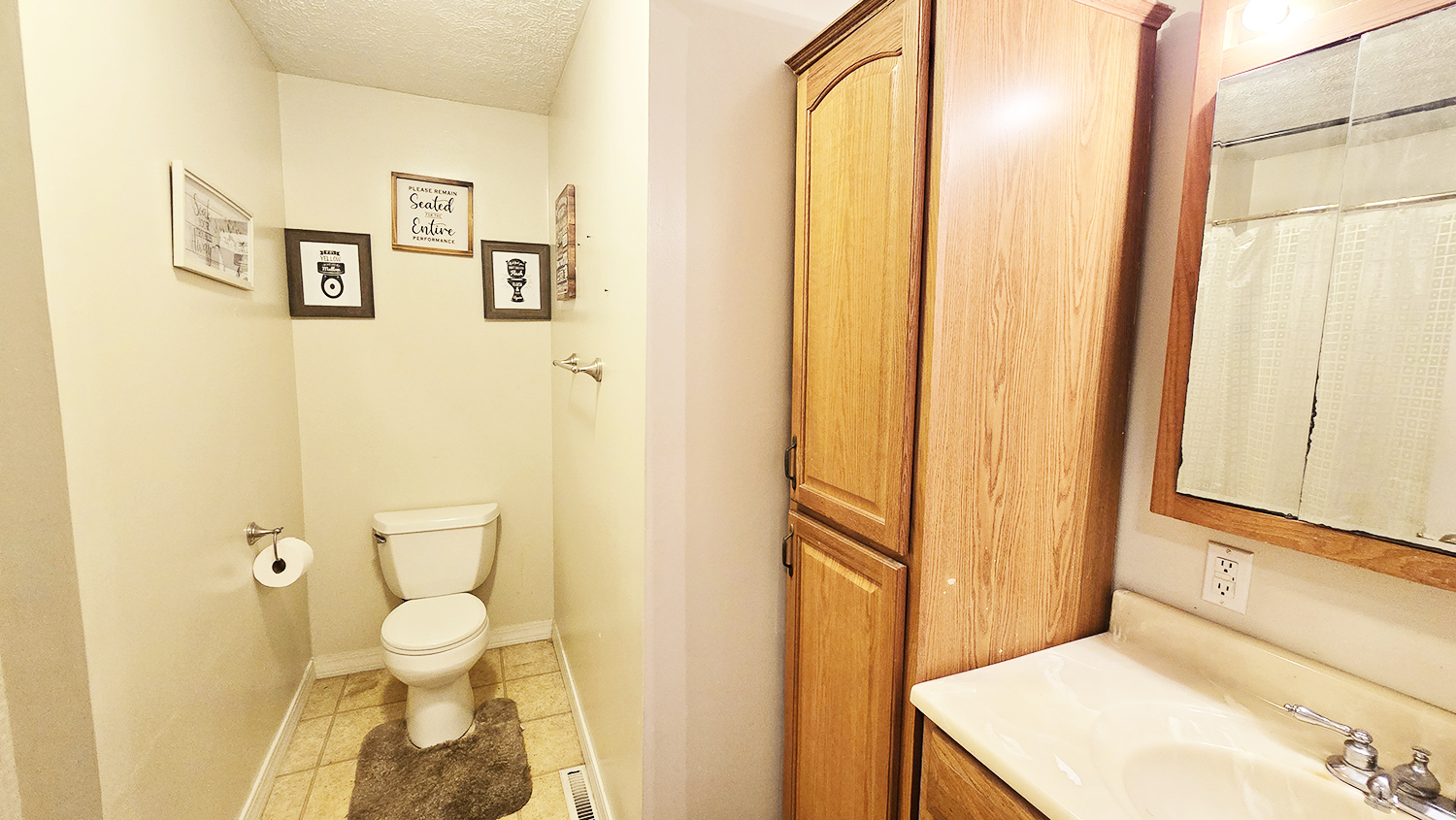 614 East Superior Street Irvington, IL 62848 - Photo 35 of 41 a bathroom with a sink and a mirror