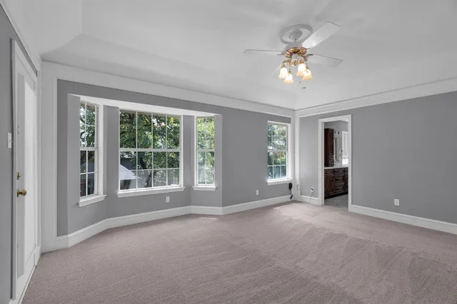 a bathroom with a double vanity sink large mirror and a bathtub