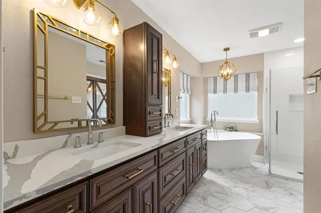 a bathroom with a bathtub and a shower