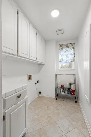 a view of a chairs and table in a backyard