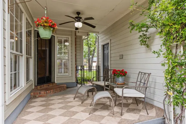 a bathroom with a granite countertop toilet sink and mirror