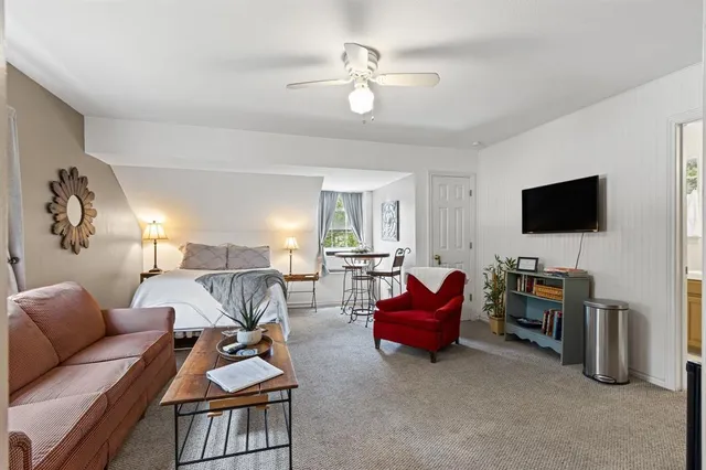 a view of a backyard with sitting area