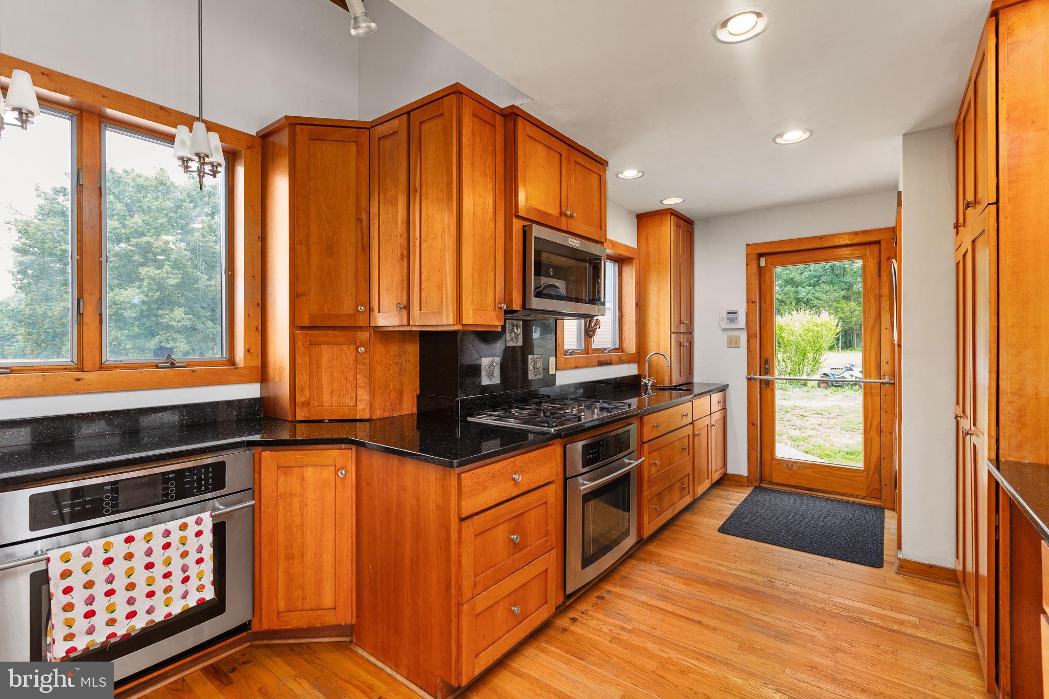 6119 Beach Road Midland, VA 22728 - Photo 41 of 98 a kitchen with stainless steel appliances a stove sink and cabinets